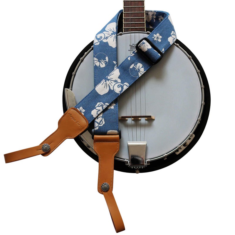 MUSIC FIRST Original Design, 2 inch width (5cm), Hawaii Style â€œBlue and White Plumeriaâ€ Soft Canvas & Genuine Leather Delux Banjo Strap, With 2 pieces of MUSIC FIRST Leather Strap Locker. - Image 1